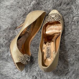 Beautiful gold metallic heels with a rhinestone embellishment